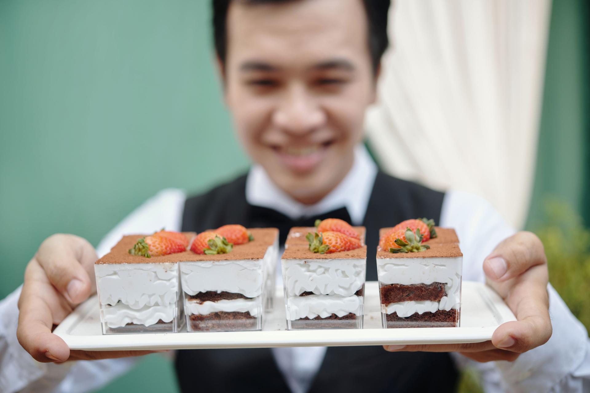 Presenting Delicious Tiramisu Desserts with Fresh Strawberries