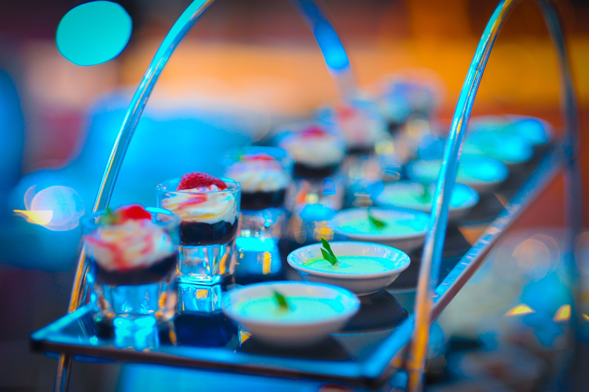 Beautiful multicolored decorated baked sweet tasty party cakes or catering cakes for party, bar dessert selection with cake, pie and pastries catering banquet, coffee break buffet at a conference